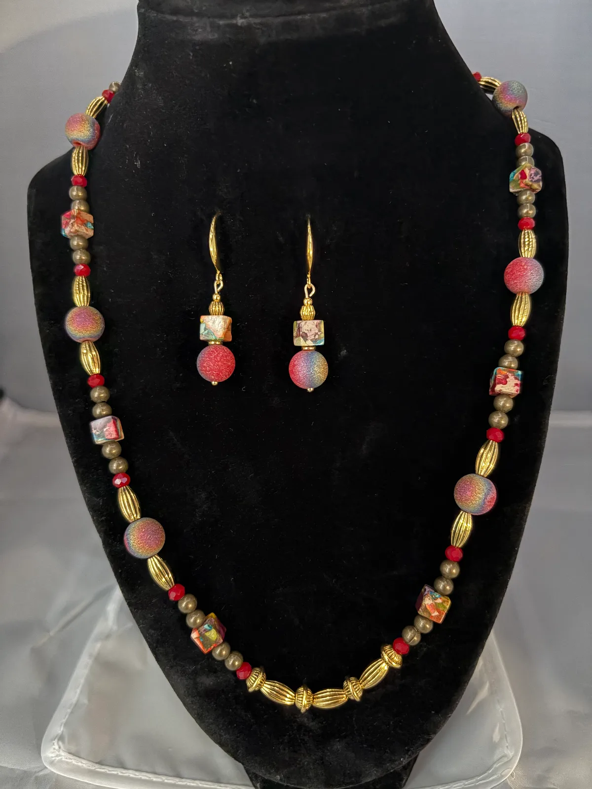 Burgundy and gold earth tone necklace and earring set handcrafted by Patty