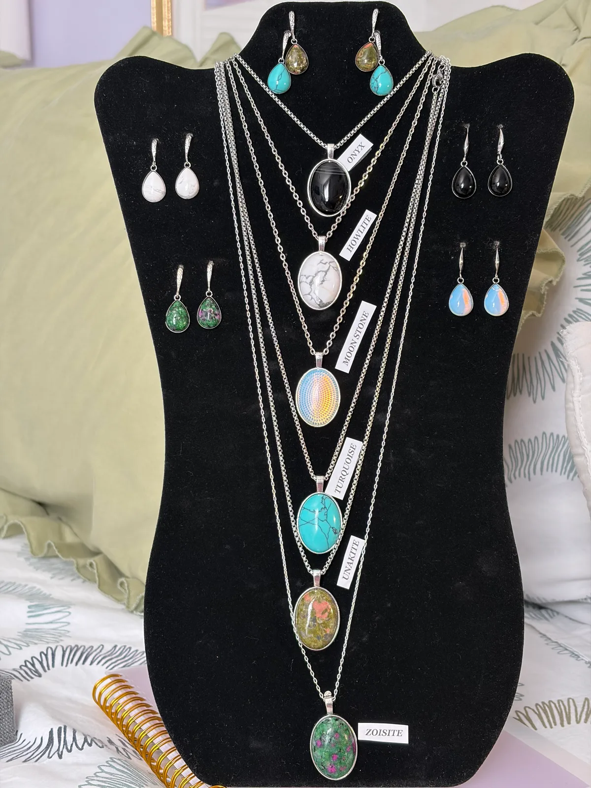 Display of Patty's silver stone pendant necklaces and earrings