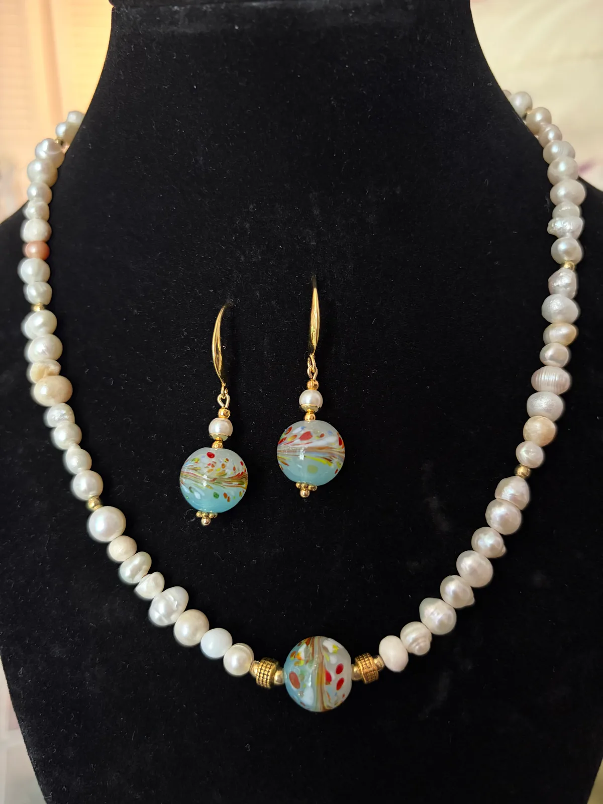 White pearl and blue accent necklace and earring set handcrafted by Patty